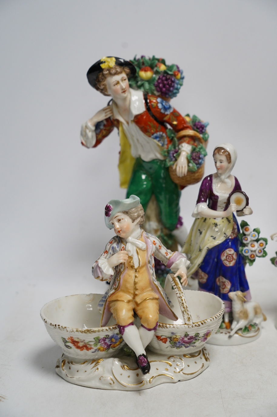 Four Samson porcelain figures and a pair of Dresden ‘children’ salts, tallest 23cm. Condition - salt handle broken